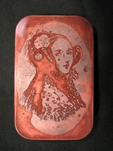 Ada Lovelace. etched altoids tin. Hieronymus Isambard von Slatt 2009