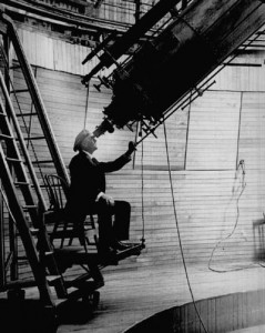 percival_lowell-observing_mars_from_the_lowell_observatory <em>Percival Lowell in his observatory.</em>